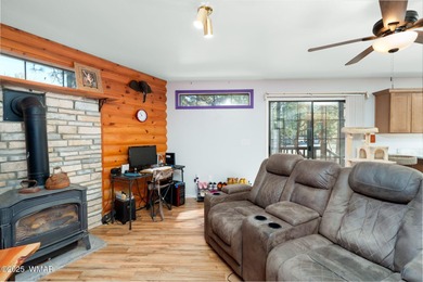 Tucked among towering pines, this inviting cabin offers the calm on Torreon Golf Club in Arizona - for sale on GolfHomes.com, golf home, golf lot