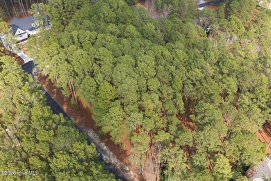 Beautiful 0.86-acre homesite in the gated community of Pinewild on Pinewild Country Club of Pinehurst in North Carolina - for sale on GolfHomes.com, golf home, golf lot