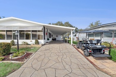 Welcome home to this beautifully updated 2-bedroom, 2-bath on Lake Henry Golf Club in Florida - for sale on GolfHomes.com, golf home, golf lot