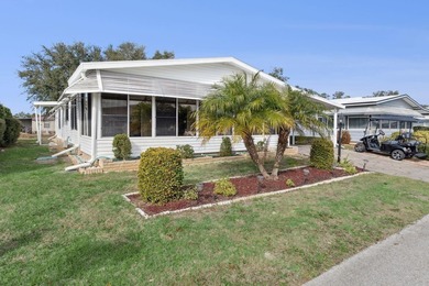 Welcome home to this beautifully updated 2-bedroom, 2-bath on Lake Henry Golf Club in Florida - for sale on GolfHomes.com, golf home, golf lot