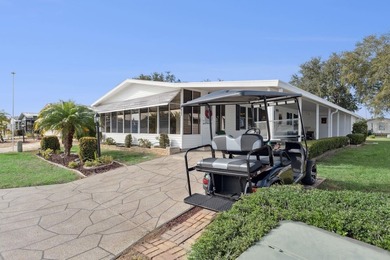 Welcome home to this beautifully updated 2-bedroom, 2-bath on Lake Henry Golf Club in Florida - for sale on GolfHomes.com, golf home, golf lot