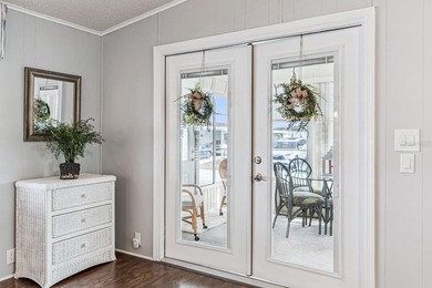 Welcome home to this beautifully updated 2-bedroom, 2-bath on Lake Henry Golf Club in Florida - for sale on GolfHomes.com, golf home, golf lot