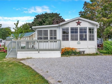 On a generous lot in Apple Island Resort, this furnished on Apple Island Golf Course At Apple Island Resort in Vermont - for sale on GolfHomes.com, golf home, golf lot
