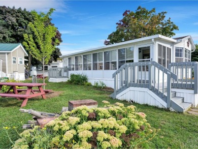 On a generous lot in Apple Island Resort, this furnished on Apple Island Golf Course At Apple Island Resort in Vermont - for sale on GolfHomes.com, golf home, golf lot