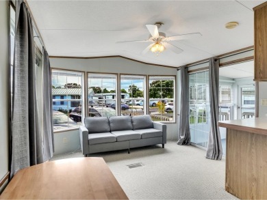 On a generous lot in Apple Island Resort, this furnished on Apple Island Golf Course At Apple Island Resort in Vermont - for sale on GolfHomes.com, golf home, golf lot