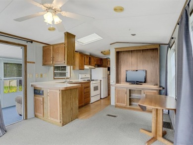 On a generous lot in Apple Island Resort, this furnished on Apple Island Golf Course At Apple Island Resort in Vermont - for sale on GolfHomes.com, golf home, golf lot