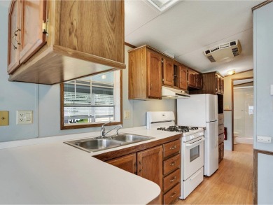 On a generous lot in Apple Island Resort, this furnished on Apple Island Golf Course At Apple Island Resort in Vermont - for sale on GolfHomes.com, golf home, golf lot