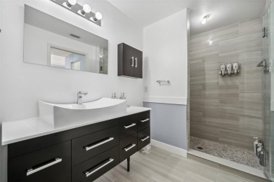 REMODELED, contemporary GROUND FLOOR condominium located on on Stoneybrook Golf and Country Club of Sarasota in Florida - for sale on GolfHomes.com, golf home, golf lot