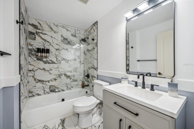 REMODELED, contemporary GROUND FLOOR condominium located on on Stoneybrook Golf and Country Club of Sarasota in Florida - for sale on GolfHomes.com, golf home, golf lot
