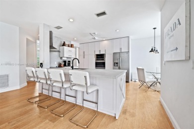 Welcome to this luxurious home featuring soaring ceilings on Weston Hills Country Club in Florida - for sale on GolfHomes.com, golf home, golf lot