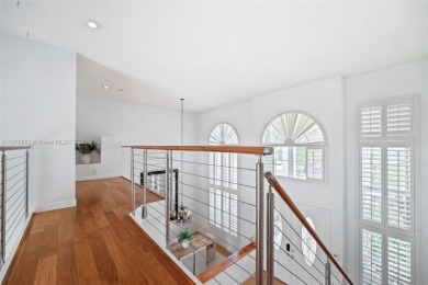 Welcome to this luxurious home featuring soaring ceilings on Weston Hills Country Club in Florida - for sale on GolfHomes.com, golf home, golf lot