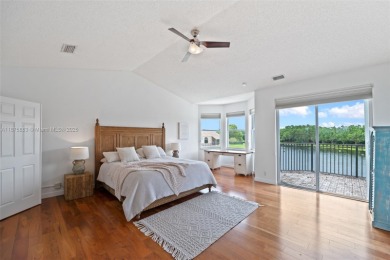 Welcome to this luxurious home featuring soaring ceilings on Weston Hills Country Club in Florida - for sale on GolfHomes.com, golf home, golf lot