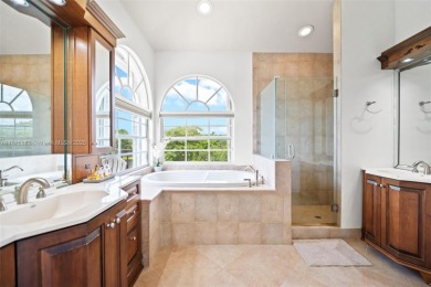 Welcome to this luxurious home featuring soaring ceilings on Weston Hills Country Club in Florida - for sale on GolfHomes.com, golf home, golf lot