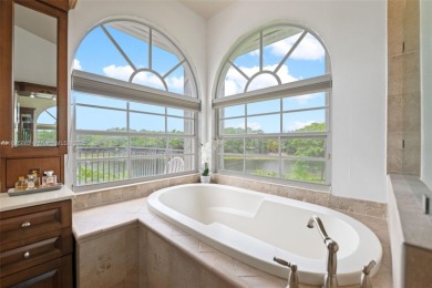 Welcome to this luxurious home featuring soaring ceilings on Weston Hills Country Club in Florida - for sale on GolfHomes.com, golf home, golf lot