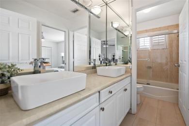 Welcome to this luxurious home featuring soaring ceilings on Weston Hills Country Club in Florida - for sale on GolfHomes.com, golf home, golf lot