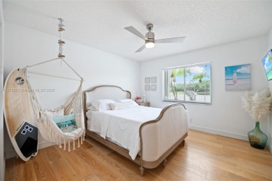 Welcome to this luxurious home featuring soaring ceilings on Weston Hills Country Club in Florida - for sale on GolfHomes.com, golf home, golf lot