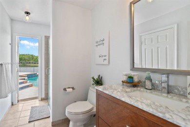 Welcome to this luxurious home featuring soaring ceilings on Weston Hills Country Club in Florida - for sale on GolfHomes.com, golf home, golf lot
