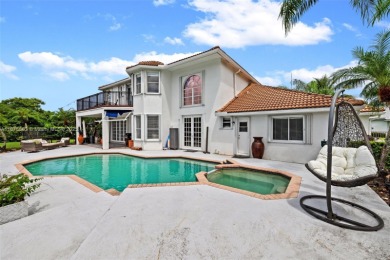 Welcome to this luxurious home featuring soaring ceilings on Weston Hills Country Club in Florida - for sale on GolfHomes.com, golf home, golf lot
