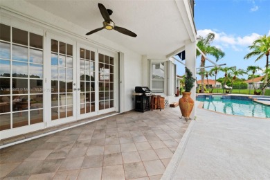 Welcome to this luxurious home featuring soaring ceilings on Weston Hills Country Club in Florida - for sale on GolfHomes.com, golf home, golf lot