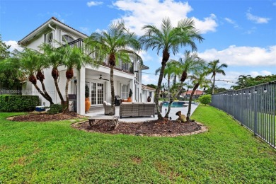 Welcome to this luxurious home featuring soaring ceilings on Weston Hills Country Club in Florida - for sale on GolfHomes.com, golf home, golf lot