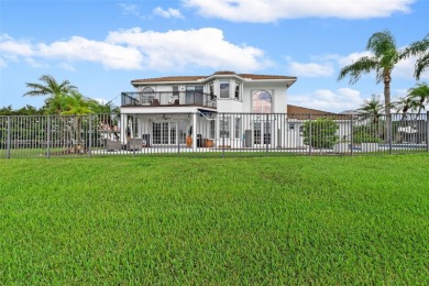 Welcome to this luxurious home featuring soaring ceilings on Weston Hills Country Club in Florida - for sale on GolfHomes.com, golf home, golf lot