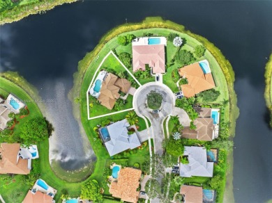 Welcome to this luxurious home featuring soaring ceilings on Weston Hills Country Club in Florida - for sale on GolfHomes.com, golf home, golf lot