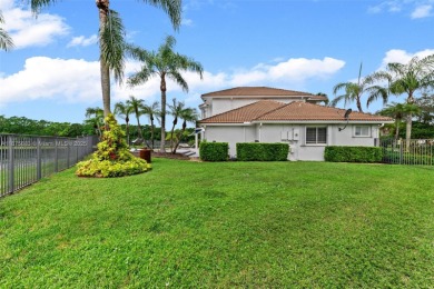 Welcome to this luxurious home featuring soaring ceilings on Weston Hills Country Club in Florida - for sale on GolfHomes.com, golf home, golf lot