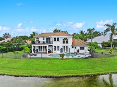 Welcome to this luxurious home featuring soaring ceilings on Weston Hills Country Club in Florida - for sale on GolfHomes.com, golf home, golf lot