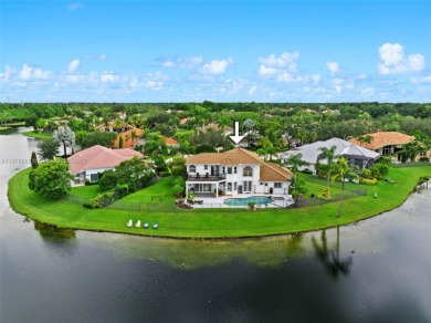 Welcome to this luxurious home featuring soaring ceilings on Weston Hills Country Club in Florida - for sale on GolfHomes.com, golf home, golf lot