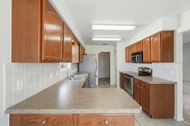 Enjoy easy Florida living in this beautifully maintained and on Highland Fairways Golf Club in Florida - for sale on GolfHomes.com, golf home, golf lot