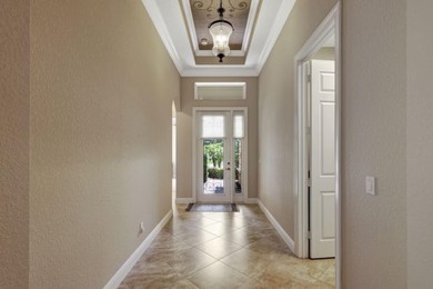 Former model home loaded with upgrades! Soaring volume ceilings on PGA Golf Club in PGA Village in Florida - for sale on GolfHomes.com, golf home, golf lot