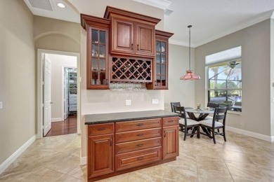 Former model home loaded with upgrades! Soaring volume ceilings on PGA Golf Club in PGA Village in Florida - for sale on GolfHomes.com, golf home, golf lot