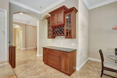 Former model home loaded with upgrades! Soaring volume ceilings on PGA Golf Club in PGA Village in Florida - for sale on GolfHomes.com, golf home, golf lot