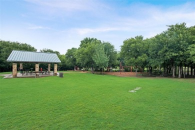 This wonderful property located in The Shores is situated on the on The Shores Country Club in Texas - for sale on GolfHomes.com, golf home, golf lot
