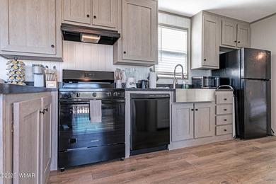 Step into this beautifully decorated, like-new 2024 home located on Silver Creek Golf Club in Arizona - for sale on GolfHomes.com, golf home, golf lot