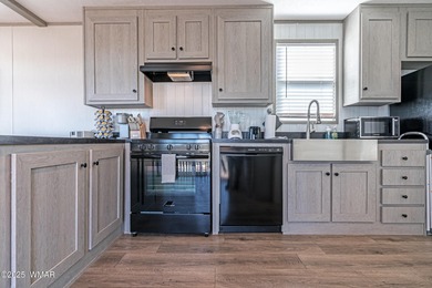 Step into this beautifully decorated, like-new 2024 home located on Silver Creek Golf Club in Arizona - for sale on GolfHomes.com, golf home, golf lot