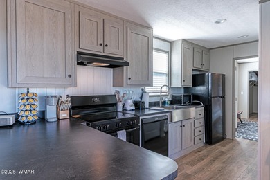 Step into this beautifully decorated, like-new 2024 home located on Silver Creek Golf Club in Arizona - for sale on GolfHomes.com, golf home, golf lot