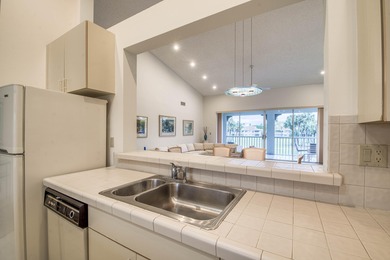 Second-floor 2-bedroom, 2-bath condo with an expansive on PGA National Golf Club in Florida - for sale on GolfHomes.com, golf home, golf lot