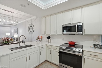 Turnkey Updated 2+Den End Unit with Golf & Lake Views | TPC on TPC At Treviso Bay in Florida - for sale on GolfHomes.com, golf home, golf lot