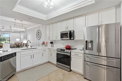 Turnkey Updated 2+Den End Unit with Golf & Lake Views | TPC on TPC At Treviso Bay in Florida - for sale on GolfHomes.com, golf home, golf lot