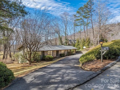 Tucked along the fairways of the Country Club of Asheville, this on  in North Carolina - for sale on GolfHomes.com, golf home, golf lot