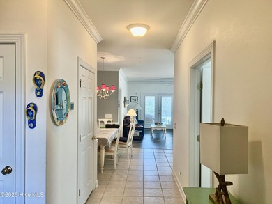 Beautifully decorated and fully furnished second-floor end unit on Sea Trail Golf Resort in North Carolina - for sale on GolfHomes.com, golf home, golf lot