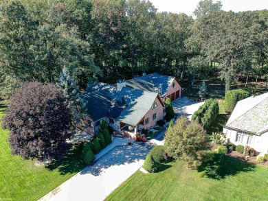 This stunning 3,900 square foot home is nestled on a picturesque on St Clair River Country Club in Michigan - for sale on GolfHomes.com, golf home, golf lot