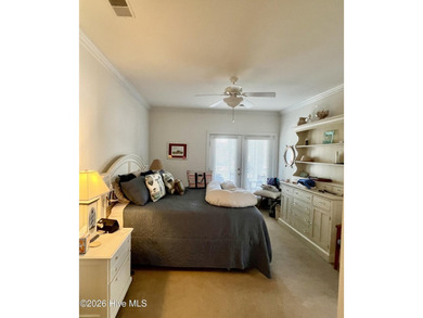 Beautifully decorated and fully furnished second-floor end unit on Sea Trail Golf Resort in North Carolina - for sale on GolfHomes.com, golf home, golf lot