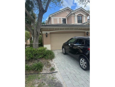 Spacious Coach Home with Golf Course Views in Weston Hills on Weston Hills Country Club in Florida - for sale on GolfHomes.com, golf home, golf lot