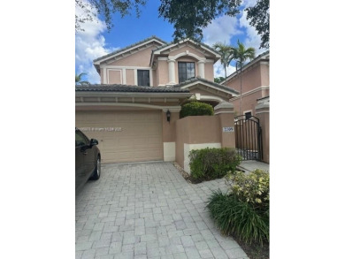Spacious Coach Home with Golf Course Views in Weston Hills on Weston Hills Country Club in Florida - for sale on GolfHomes.com, golf home, golf lot