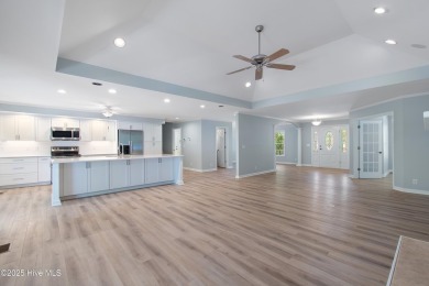 Come explore this beautifully renovated 3,100-square-foot home on Sea Trail Golf Resort in North Carolina - for sale on GolfHomes.com, golf home, golf lot