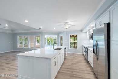 Come explore this beautifully renovated 3,100-square-foot home on Sea Trail Golf Resort in North Carolina - for sale on GolfHomes.com, golf home, golf lot