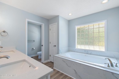 Come explore this beautifully renovated 3,100-square-foot home on Sea Trail Golf Resort in North Carolina - for sale on GolfHomes.com, golf home, golf lot