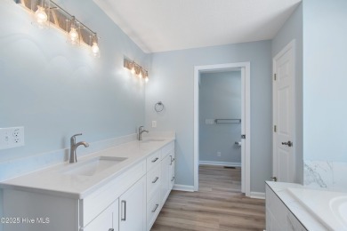 Come explore this beautifully renovated 3,100-square-foot home on Sea Trail Golf Resort in North Carolina - for sale on GolfHomes.com, golf home, golf lot